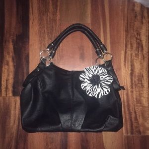 Black bag with zebra print flower